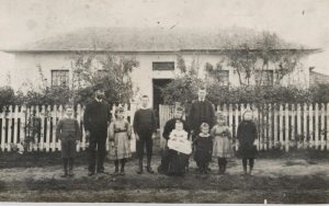 Headmaster James Taylor & Family in front of the first Sorell School
